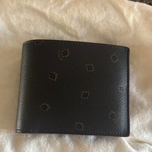 Coach Black Leather Men's Bi-Fold Wallet with Subtle Floral Motif